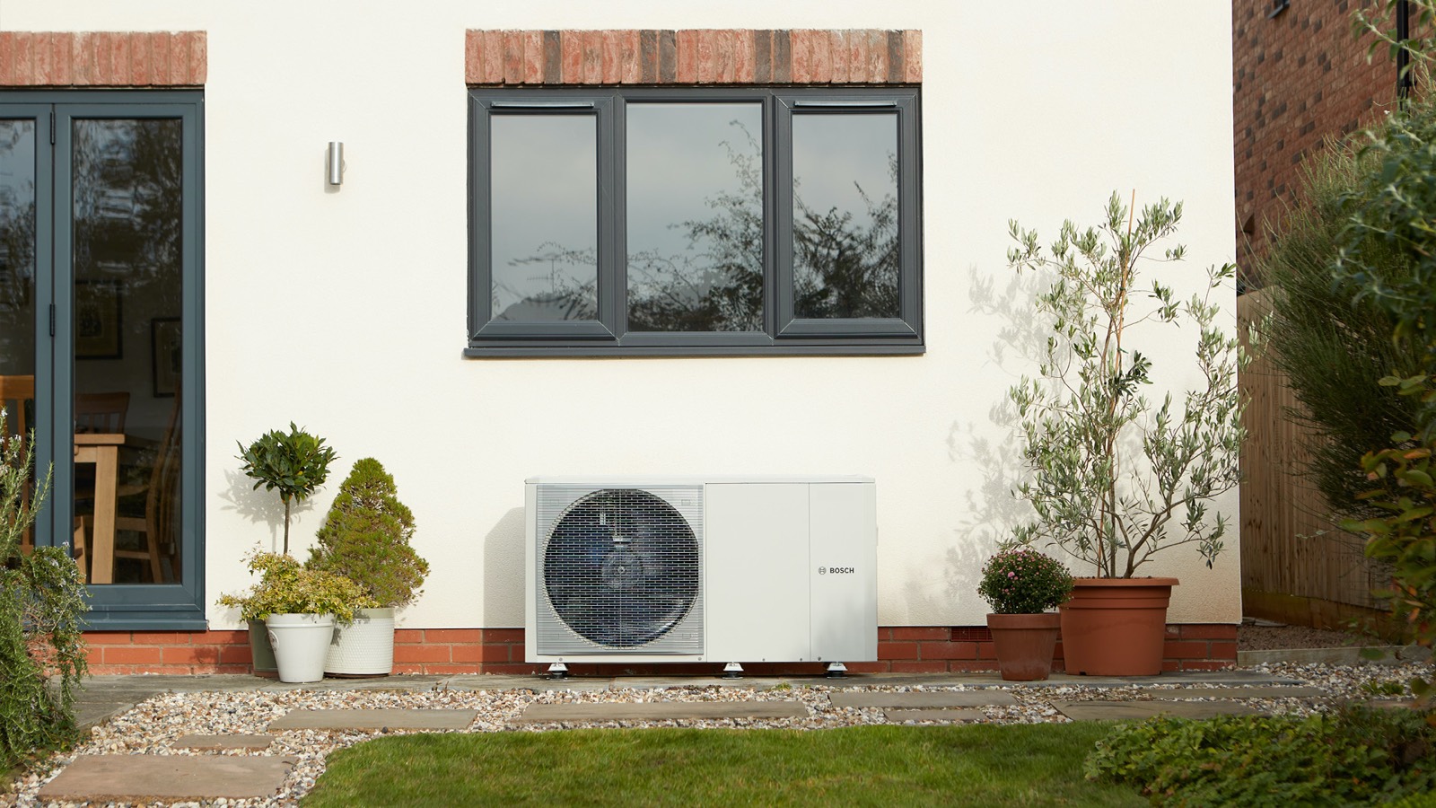 Heat pump on a rendered house