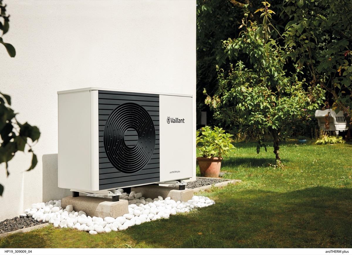 Vaillant heat pump neatly installed in a garden setting
